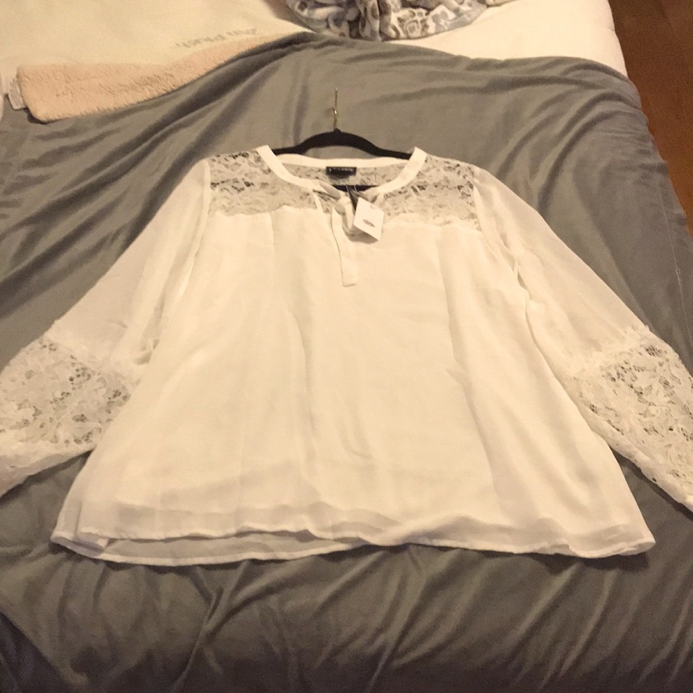 City Chic Ivory Lace Top. Size M but fits larger. Still has tags.
